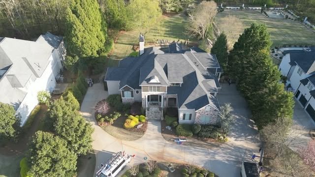 Aerial view of a completed roof replacement on a Metro Atlanta home