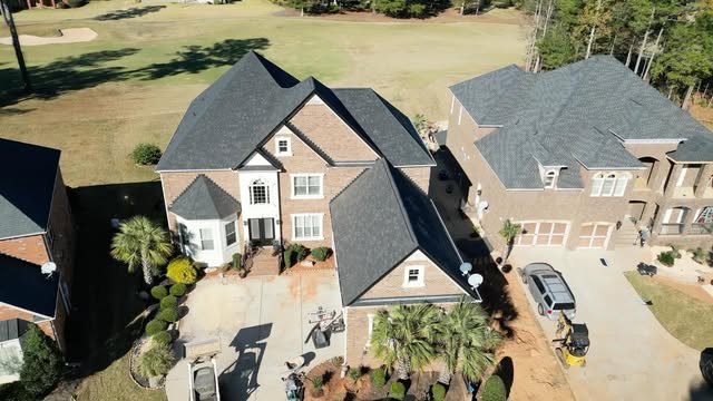 Aerial view of a completed roofing project near an Atlanta golf community